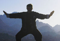 man doing qigong exercise